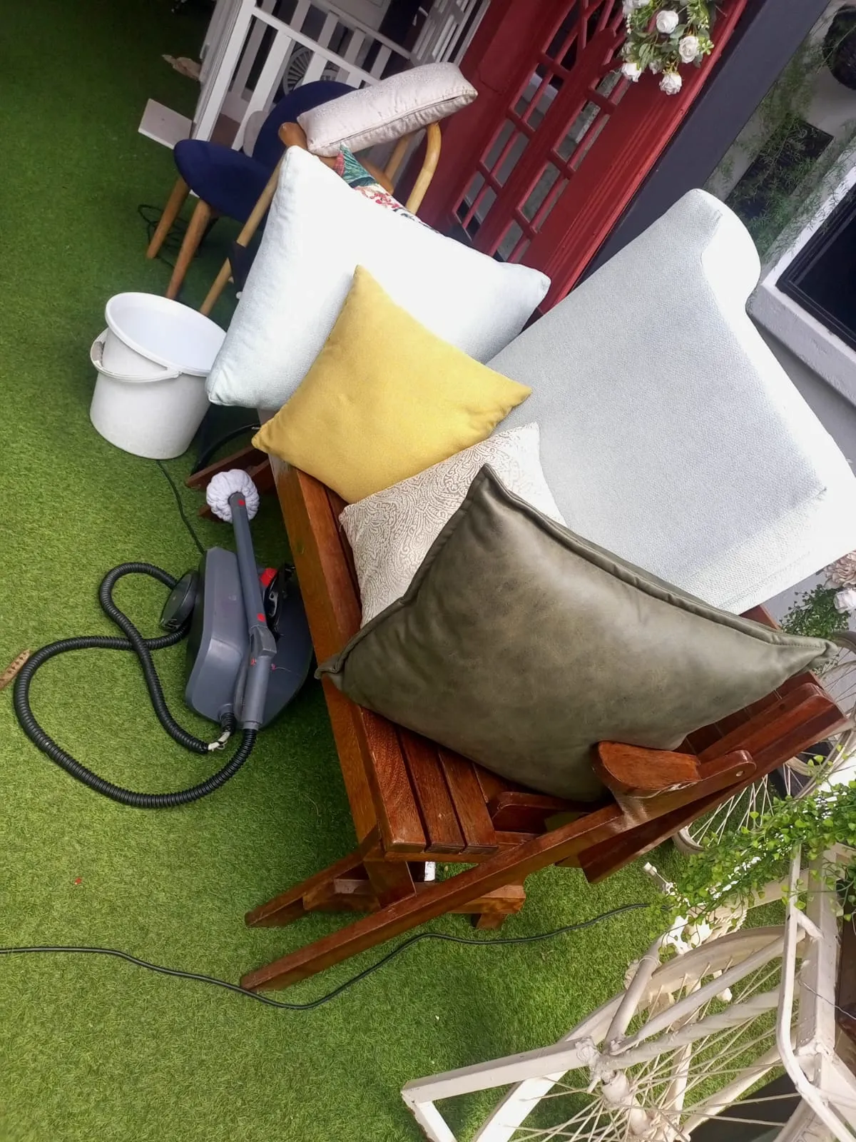 Cleaning equipment beside upholstered furniture