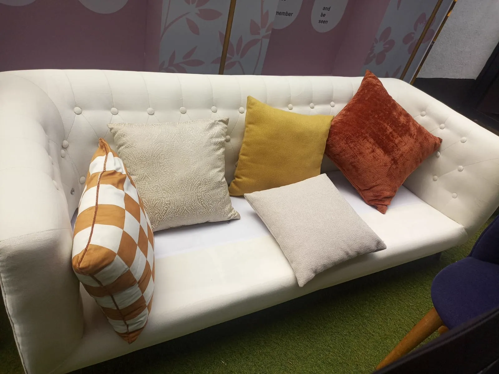 White sofa with decorative cushions