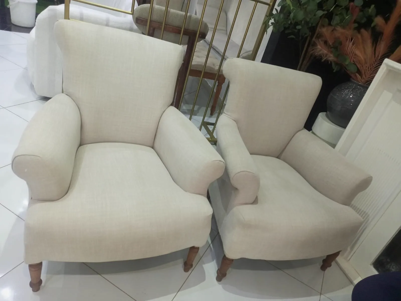 White upholstered armchairs