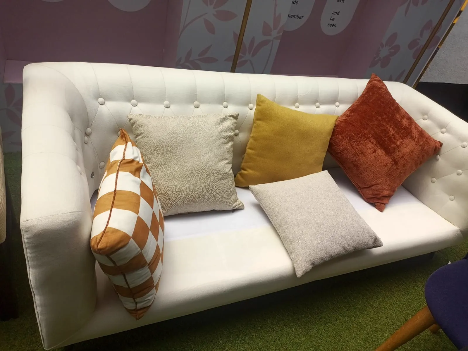 White upholstered sofa and colourful cushions